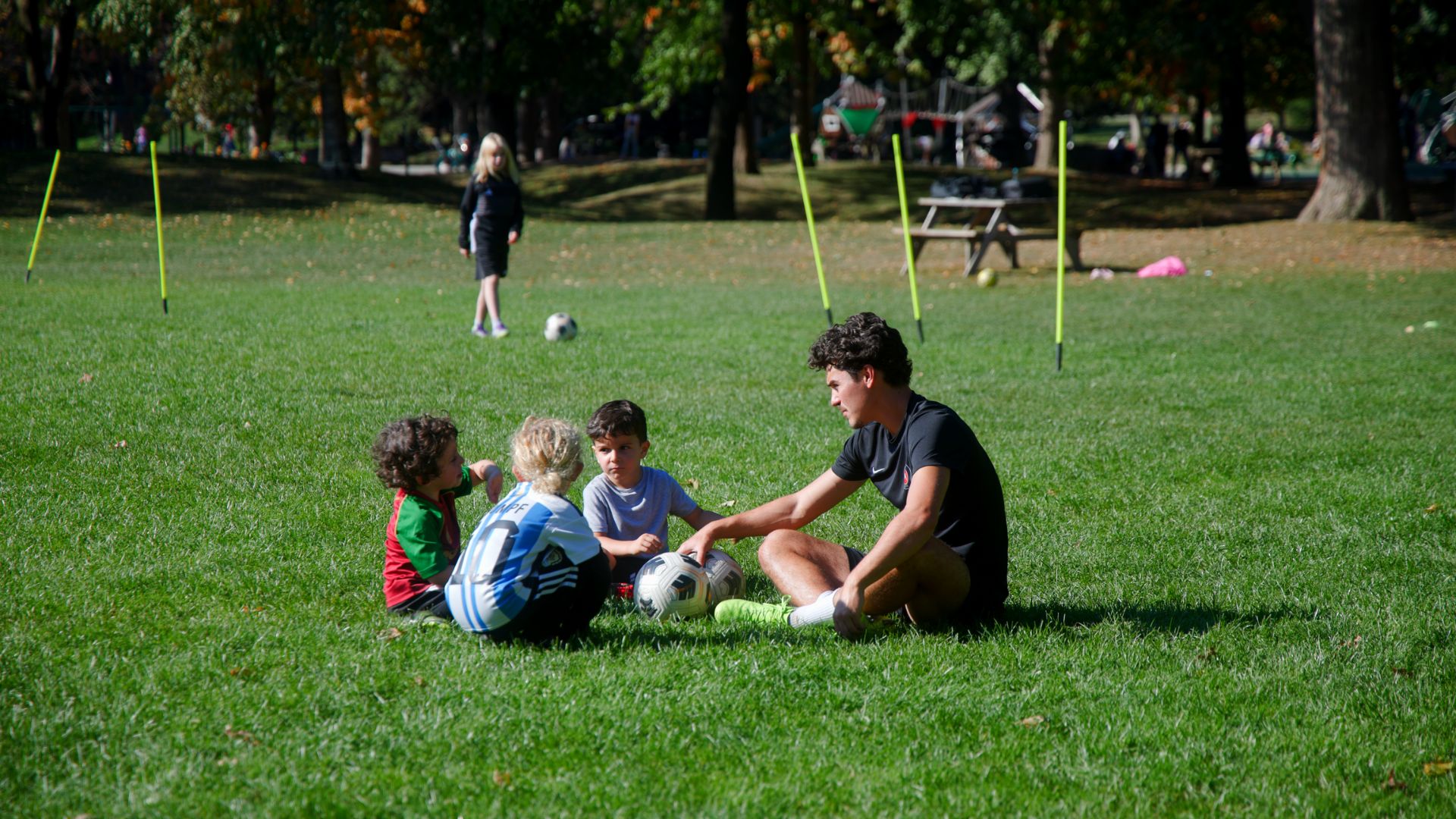 Happy young children playing soccer and having fun during training Happy young children playing soccer and having fun during training
