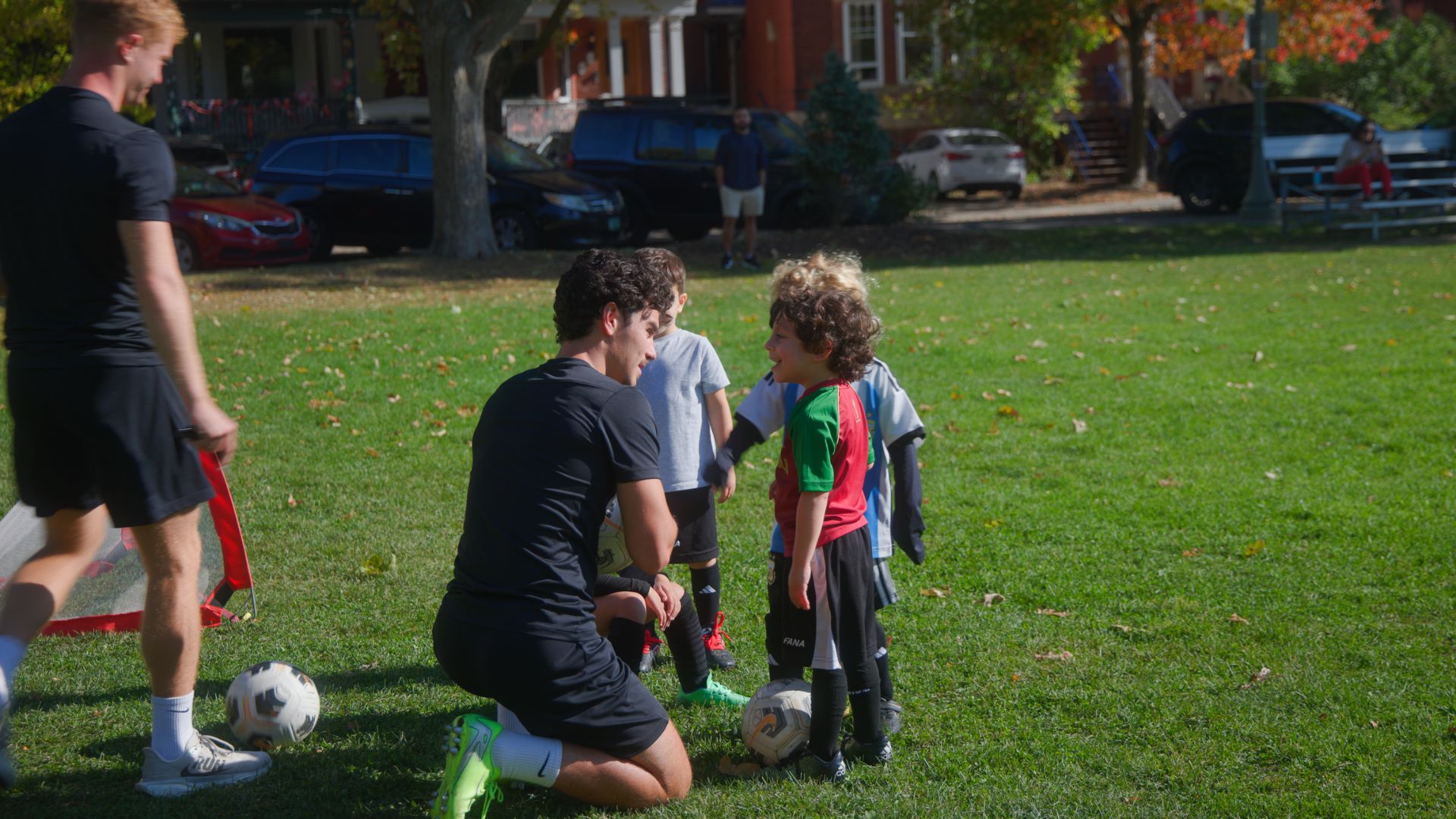Happy young children playing soccer and having fun during training Happy young children playing soccer and having fun during training